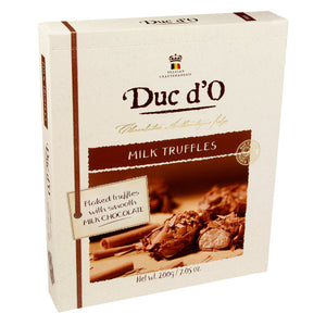 Truffles with filling rolled in chocolate flakes, packed in a gift box. Brand:Duc d’O, Belgium.
