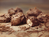 Truffles with filling rolled in chocolate flakes. Brand:Duc d’O, Belgium.